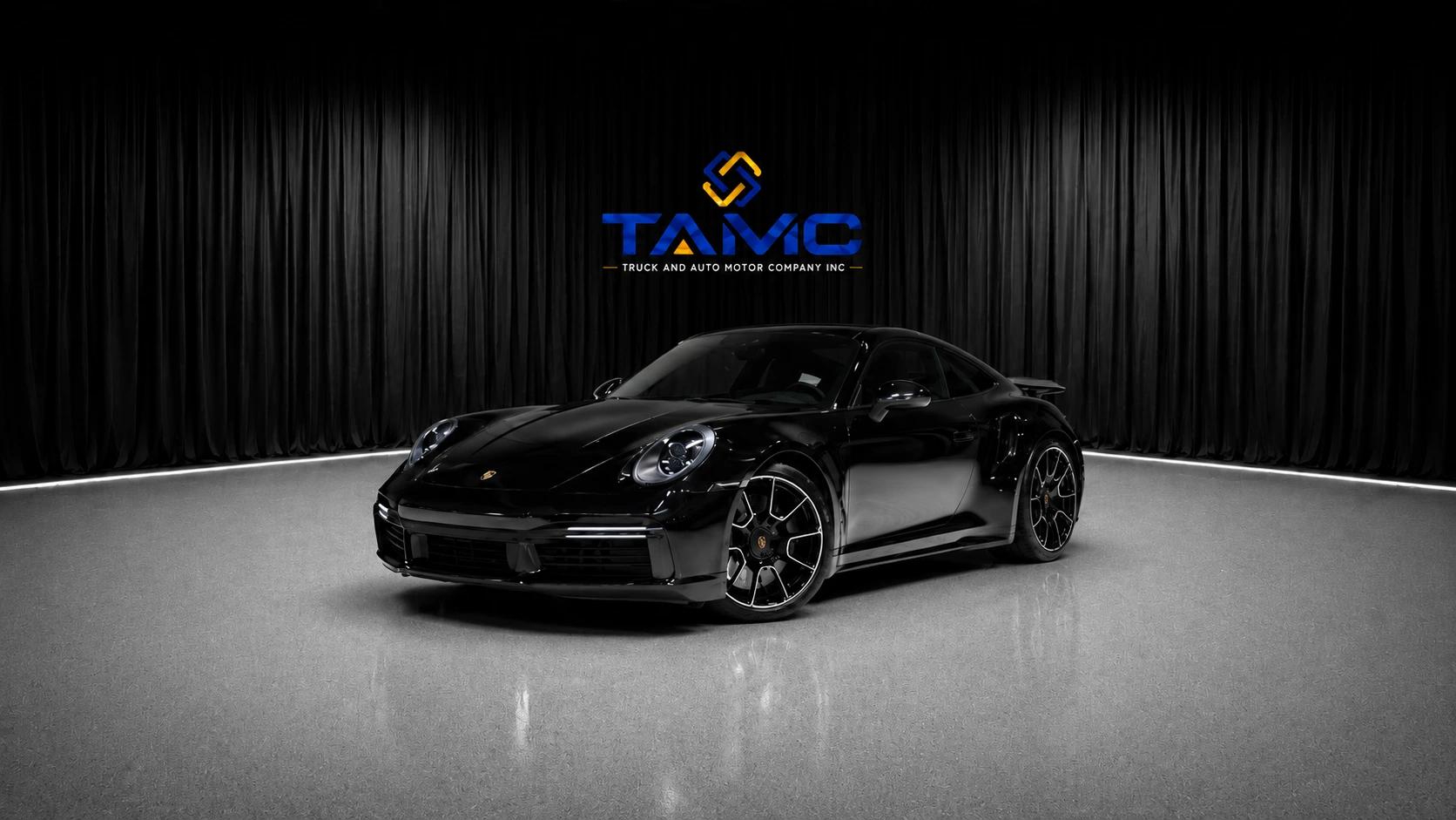 Black Porsche 911 in the Truck and Auto Motor Company showroom — Charlotte, NC